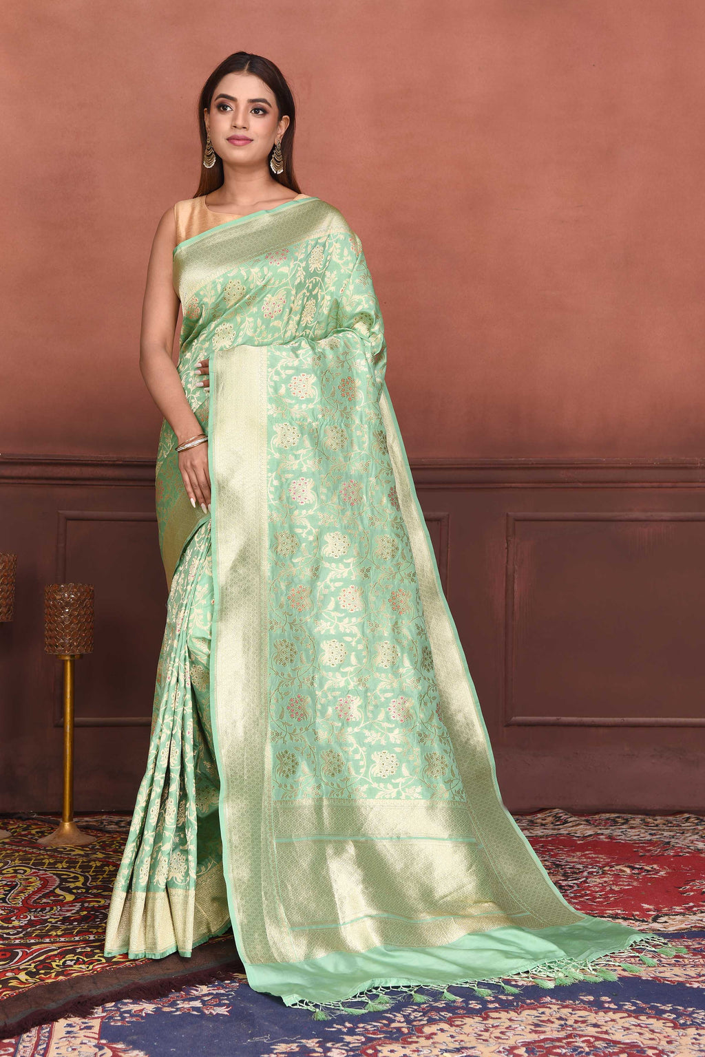 Buy beautiful pastel green Katan silk Banarasi sari online in USA with zari minakari work. Look your best on festive occasions in latest designer sarees, pure silk sarees, Kanchipuram silk sarees, handwoven sarees, tussar silk sarees, embroidered sarees from Pure Elegance Indian clothing store in USA.-full view
