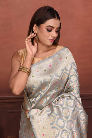 Buy light grey Katan silk Banarasi sari online in USA with zari minakari work. Look your best on festive occasions in latest designer sarees, pure silk sarees, Kanchipuram silk sarees, handwoven sarees, tussar silk sarees, embroidered sarees from Pure Elegance Indian clothing store in USA.-closeup