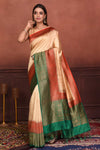 Buy cream tussar Banarasi saree online in USA with red green zari border. Look your best on festive occasions in latest designer sarees, pure silk sarees, Kanchipuram silk sarees, handwoven sarees, tussar silk sarees, embroidered sarees from Pure Elegance Indian clothing store in USA.-full view