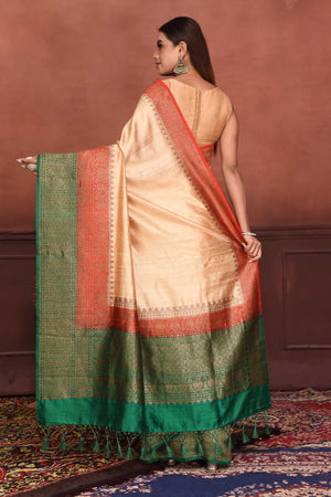 Buy cream tussar Banarasi saree online in USA with red green zari border. Look your best on festive occasions in latest designer sarees, pure silk sarees, Kanchipuram silk sarees, handwoven sarees, tussar silk sarees, embroidered sarees from Pure Elegance Indian clothing store in USA.-back