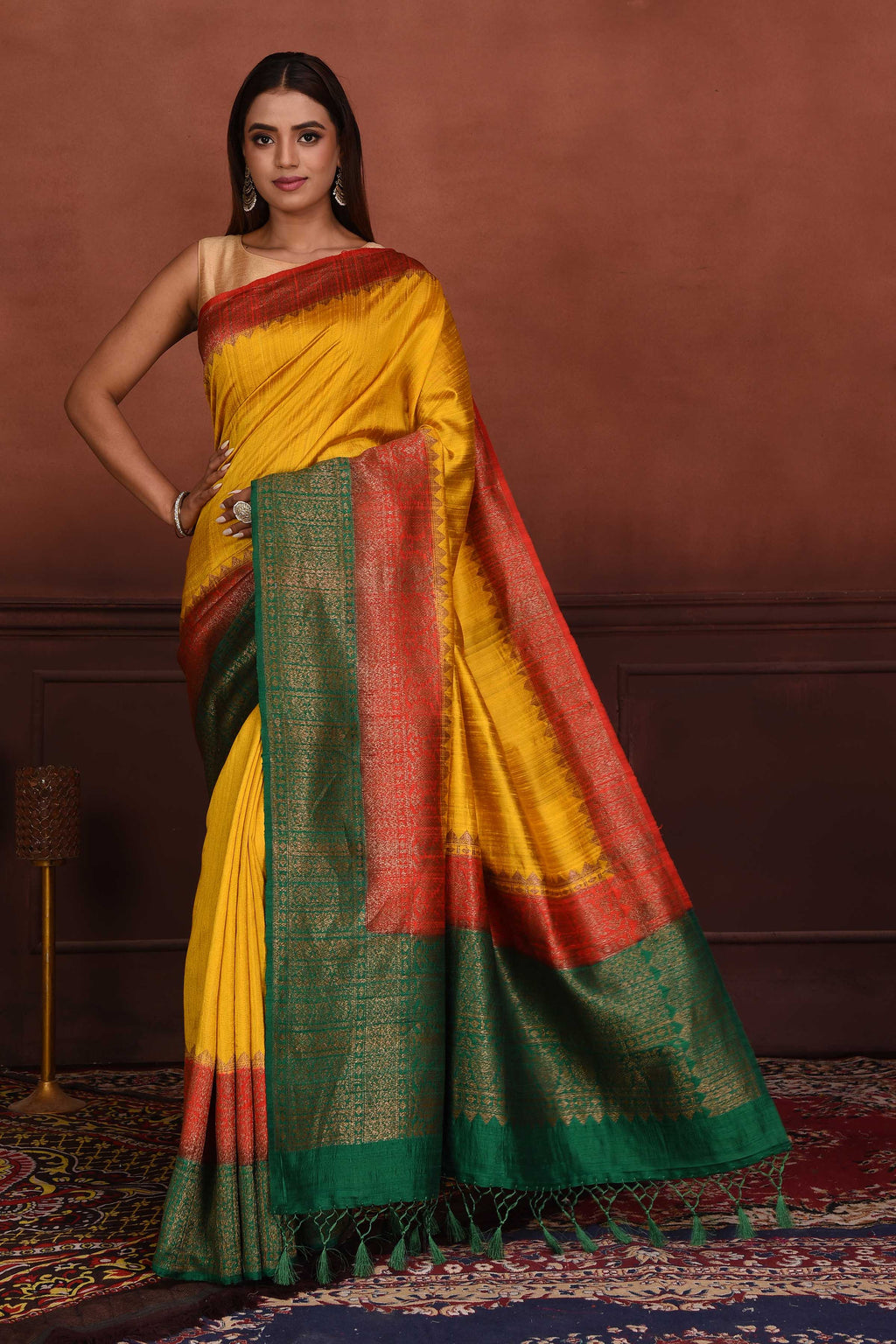 Shop yellow tussar Banarasi saree online in USA with red green zari border. Look your best on festive occasions in latest designer sarees, pure silk sarees, Kanchipuram silk sarees, handwoven sarees, tussar silk sarees, embroidered sarees from Pure Elegance Indian clothing store in USA.-full view