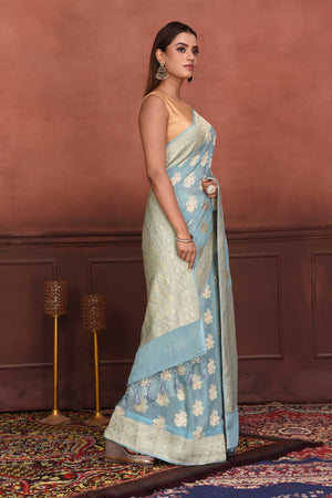 Shop light blue Katan silk Banarasi sari online in USA with zari minakari buta. Look your best on festive occasions in latest designer sarees, pure silk sarees, Kanchipuram silk sarees, handwoven sarees, tussar silk sarees, embroidered sarees from Pure Elegance Indian clothing store in USA.-side