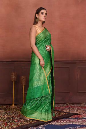 Buy green Katan silk Banarasi saree online in USA with zari work. Look your best on festive occasions in latest designer sarees, pure silk sarees, Kanchipuram silk sarees, handwoven sarees, tussar silk sarees, embroidered sarees from Pure Elegance Indian clothing store in USA.-side