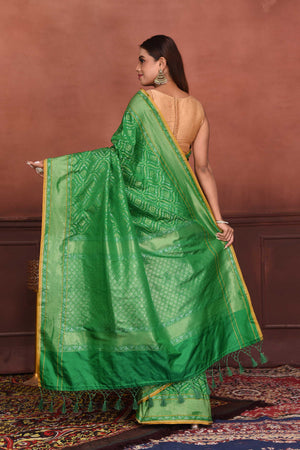 Buy green Katan silk Banarasi saree online in USA with zari work. Look your best on festive occasions in latest designer sarees, pure silk sarees, Kanchipuram silk sarees, handwoven sarees, tussar silk sarees, embroidered sarees from Pure Elegance Indian clothing store in USA.-back