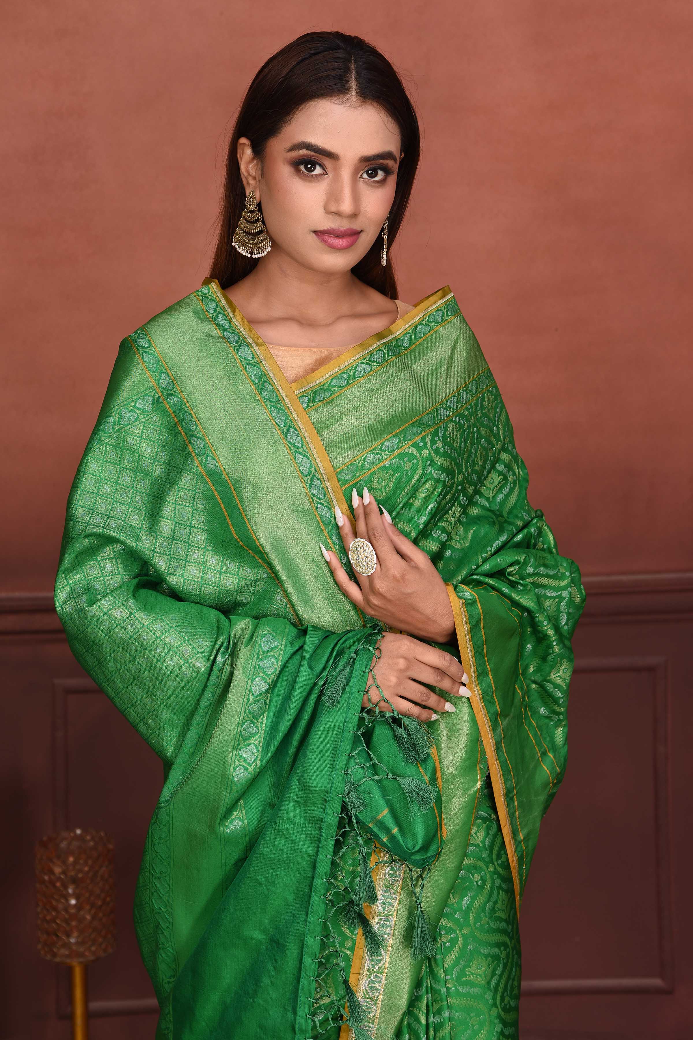 Buy green Katan silk Banarasi saree online in USA with zari work. Look your best on festive occasions in latest designer sarees, pure silk sarees, Kanchipuram silk sarees, handwoven sarees, tussar silk sarees, embroidered sarees from Pure Elegance Indian clothing store in USA.-closeup
