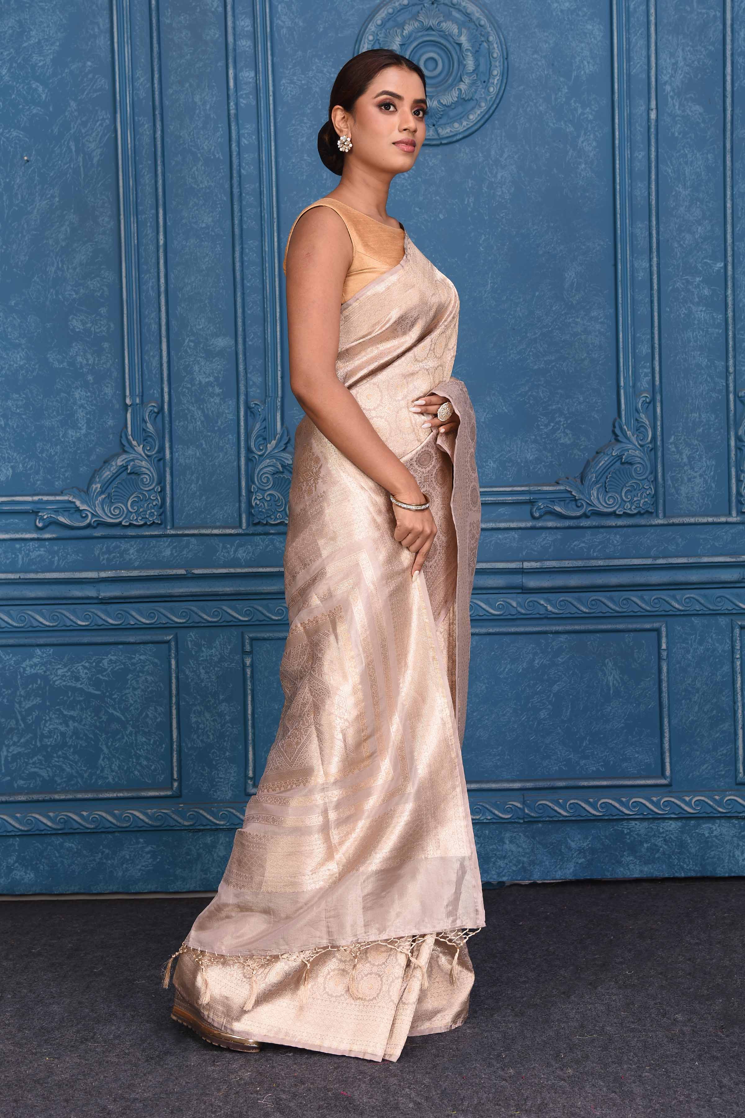 Shop stunning golden zari work Katan silk Banarasi saree online in USA. Look your best on festive occasions in latest designer sarees, pure silk saris, Kanchipuram silk sarees, handwoven sarees, tussar silk sarees, embroidered saris from Pure Elegance Indian clothing store in USA.-side