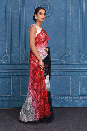 Shop stunning red and black designer lace saree online in USA. Look royal at weddings and festive occasions in exquisite designer sarees, handwoven sarees, pure silk saris, Banarasi sarees, Kanchipuram silk sarees from Pure Elegance Indian saree store in USA. -side