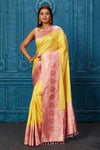 Shop yellow Banarasi saree online in USA with pink zari border. Look your best on festive occasions in latest designer sarees, pure silk saris, Kanchipuram silk sarees, handwoven sarees, tussar silk sarees, embroidered sarees from Pure Elegance Indian saree store in USA.-full view