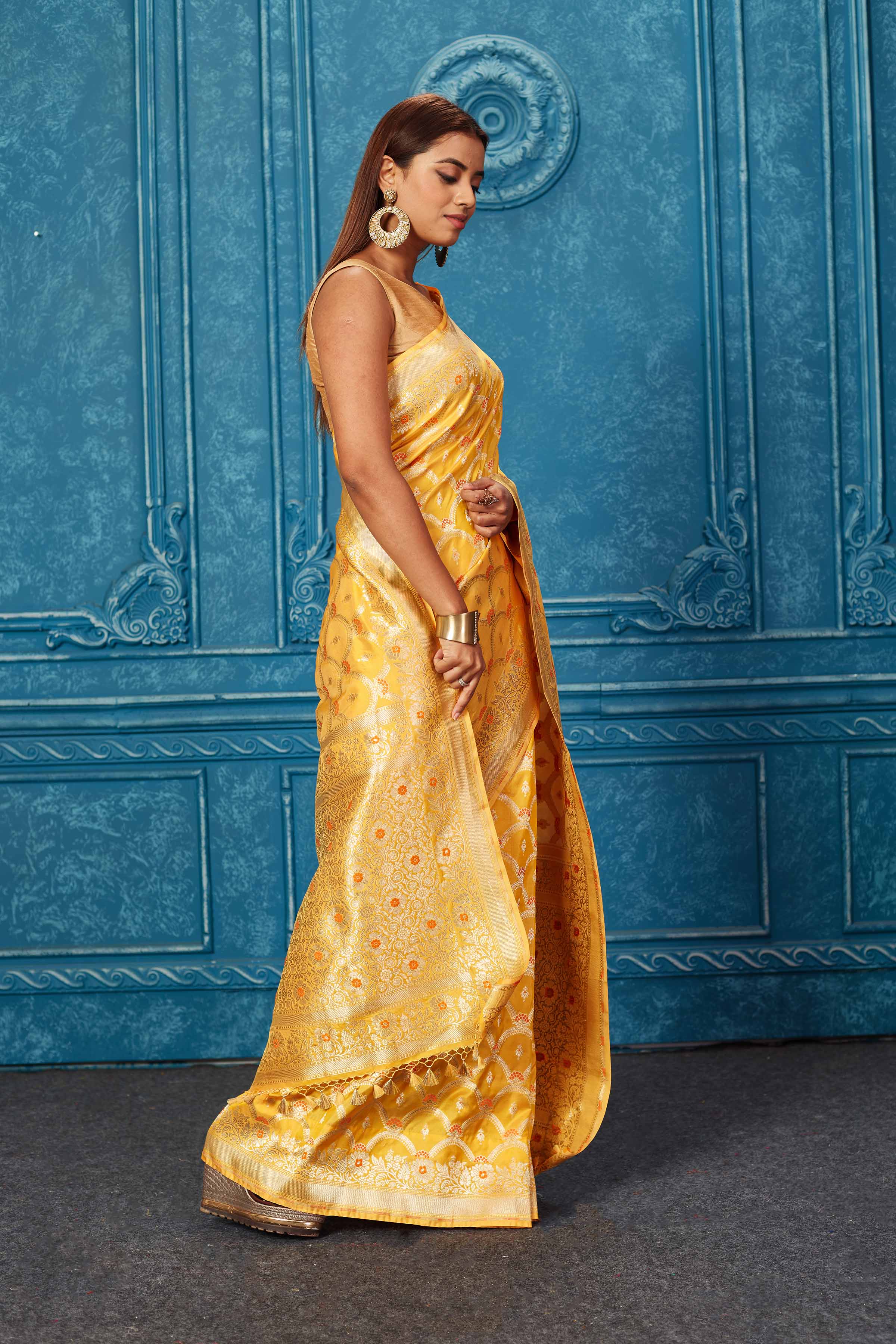 Shop mango yellow Banarasi saree online in USA with zari jaal. Look your best on festive occasions in latest designer sarees, pure silk saris, Kanchipuram silk sarees, handwoven sarees, tussar silk sarees, embroidered sarees from Pure Elegance Indian saree store in USA.-side