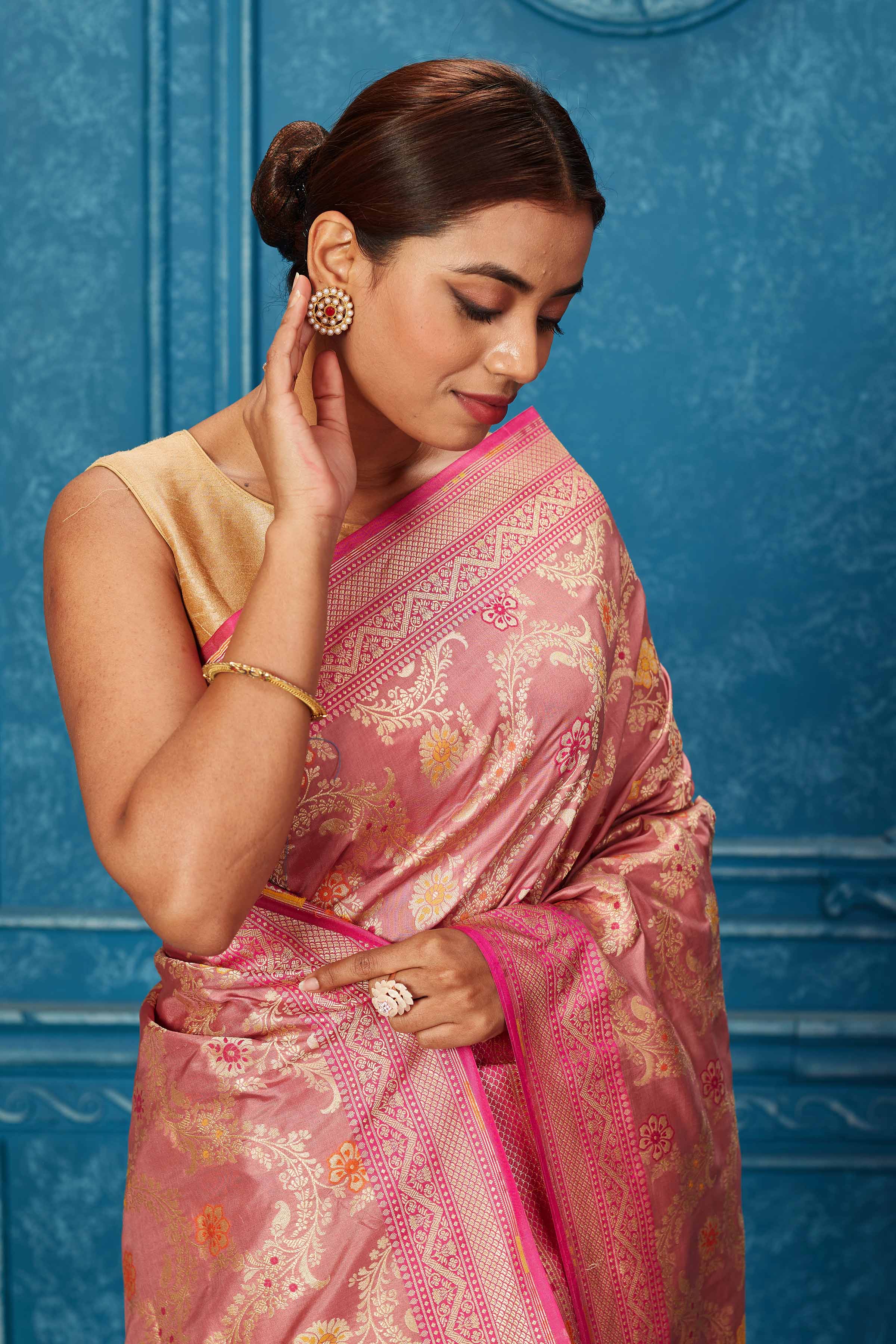 Shop blush pink Banarasi saree online in USA with zari minakari jaal. Look your best on festive occasions in latest designer sarees, pure silk saris, Kanchipuram silk sarees, handwoven sarees, tussar silk sarees, embroidered sarees from Pure Elegance Indian saree store in USA.-closeup
