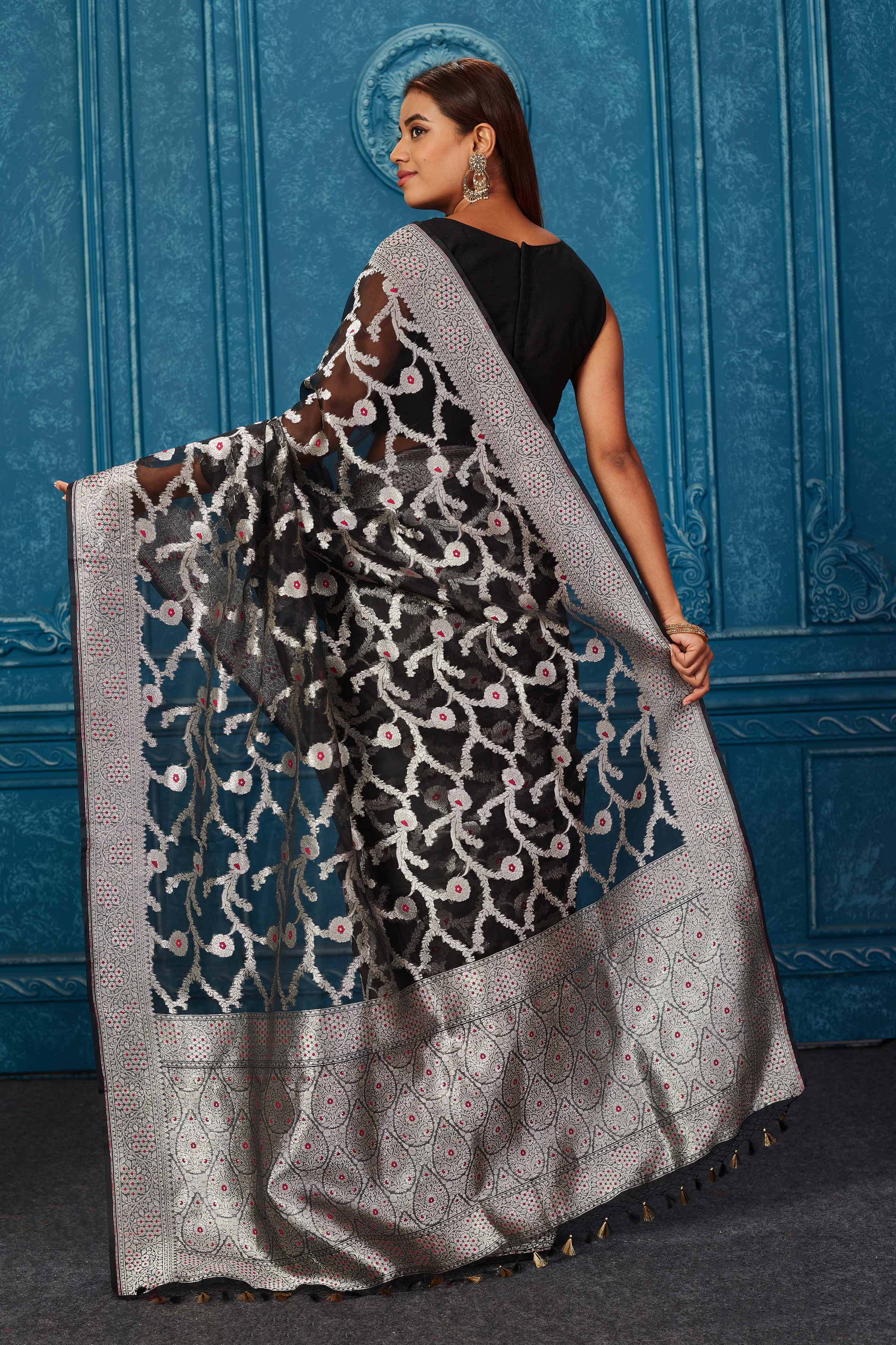 Shop black Banarasi saree online in USA with silver zari minakari work. Look your best on festive occasions in latest designer sarees, pure silk saris, Kanchipuram silk sarees, handwoven sarees, tussar silk sarees, embroidered sarees from Pure Elegance Indian saree store in USA.-back