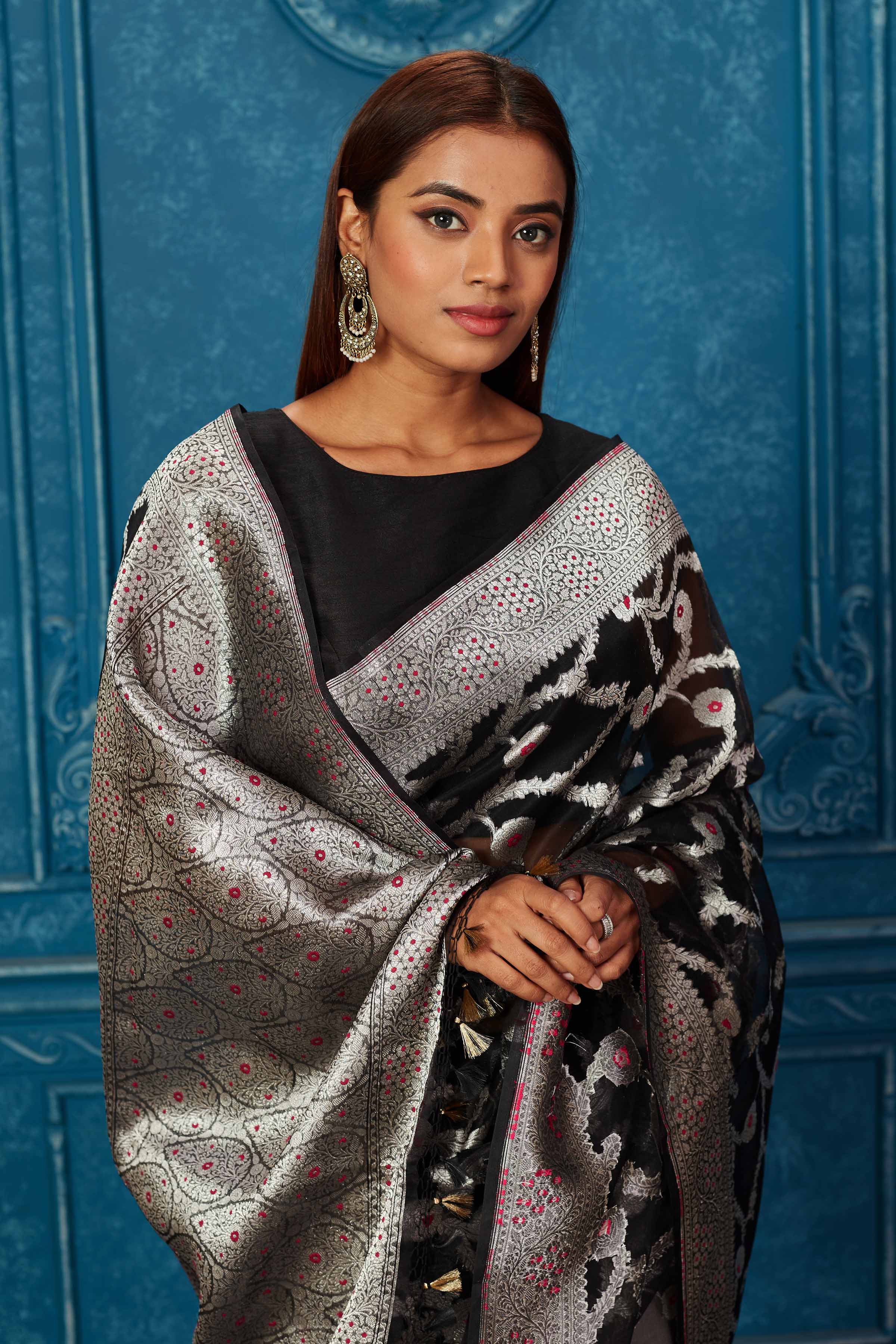 Shop black Banarasi saree online in USA with silver zari minakari work. Look your best on festive occasions in latest designer sarees, pure silk saris, Kanchipuram silk sarees, handwoven sarees, tussar silk sarees, embroidered sarees from Pure Elegance Indian saree store in USA.-closeup