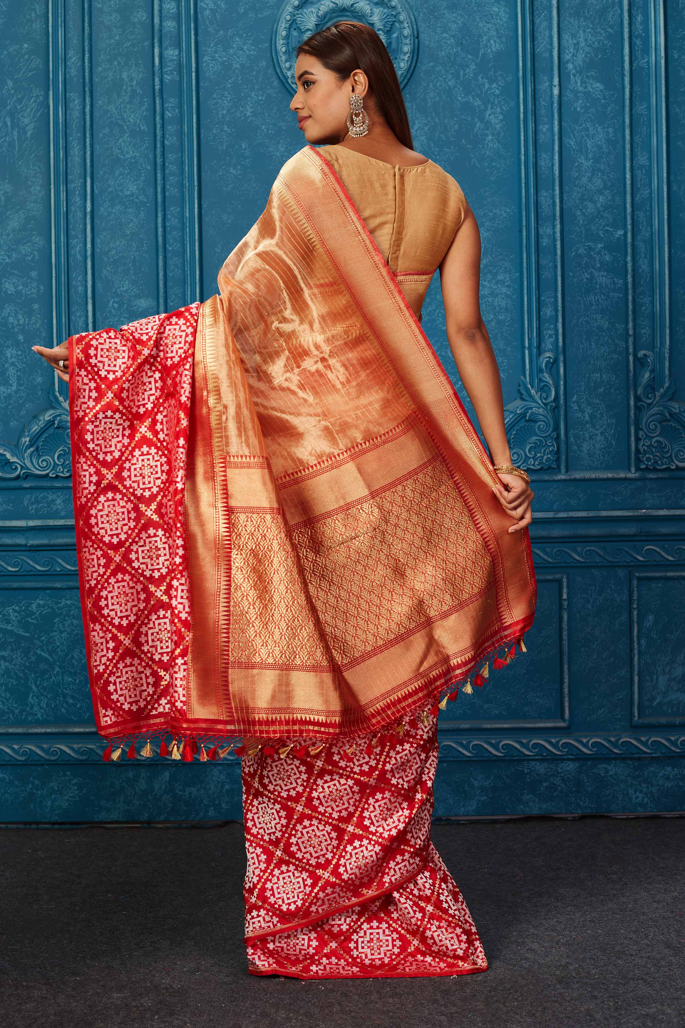 Shop golden Banarasi saree online in USA with red zari border. Look your best on festive occasions in latest designer sarees, pure silk saris, Kanchipuram silk sarees, handwoven sarees, tussar silk sarees, embroidered sarees from Pure Elegance Indian saree store in USA.-back