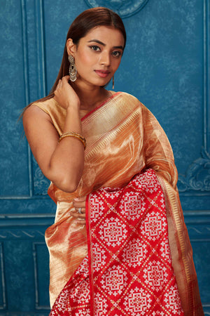 Shop golden Banarasi saree online in USA with red zari border. Look your best on festive occasions in latest designer sarees, pure silk saris, Kanchipuram silk sarees, handwoven sarees, tussar silk sarees, embroidered sarees from Pure Elegance Indian saree store in USA.-closeup