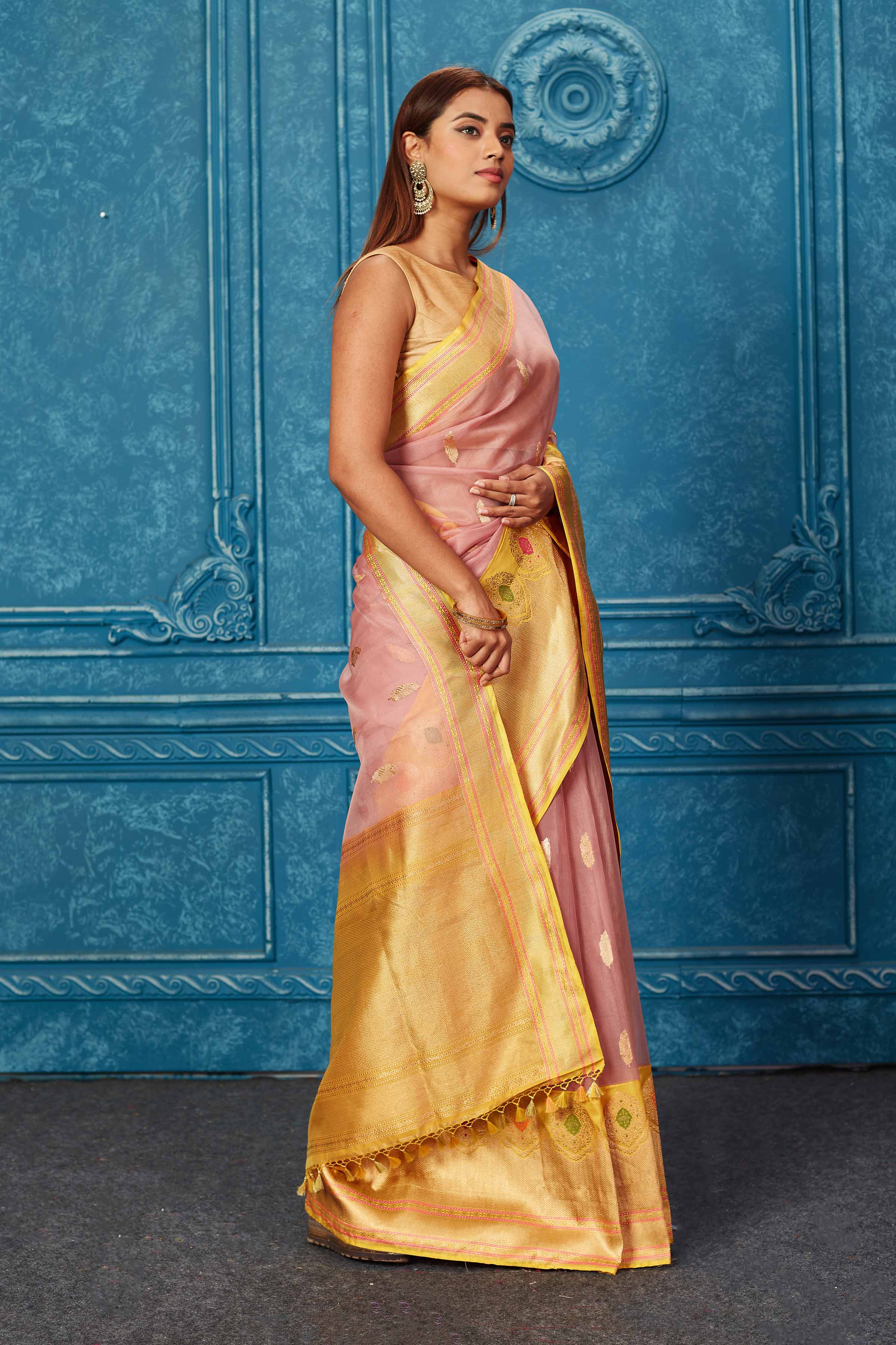 Shop dusty pink Banarasi saree online in USA with yellow zari minakari border. Look your best on festive occasions in latest designer sarees, pure silk saris, Kanchipuram silk sarees, handwoven sarees, tussar silk sarees, embroidered sarees from Pure Elegance Indian saree store in USA.-side