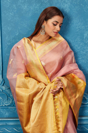 Shop dusty pink Banarasi saree online in USA with yellow zari minakari border. Look your best on festive occasions in latest designer sarees, pure silk saris, Kanchipuram silk sarees, handwoven sarees, tussar silk sarees, embroidered sarees from Pure Elegance Indian saree store in USA.-closeup