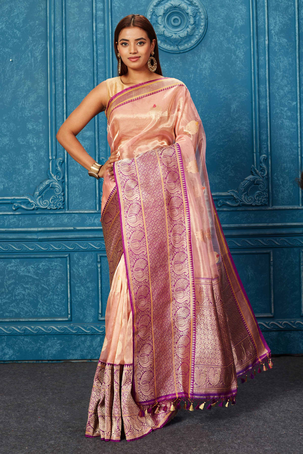 Buy golden pink Banarasi saree online in USA with purple zari border. Look your best on festive occasions in latest designer sarees, pure silk saris, Kanchipuram silk sarees, handwoven sarees, tussar silk sarees, embroidered sarees from Pure Elegance Indian saree store in USA.-full view