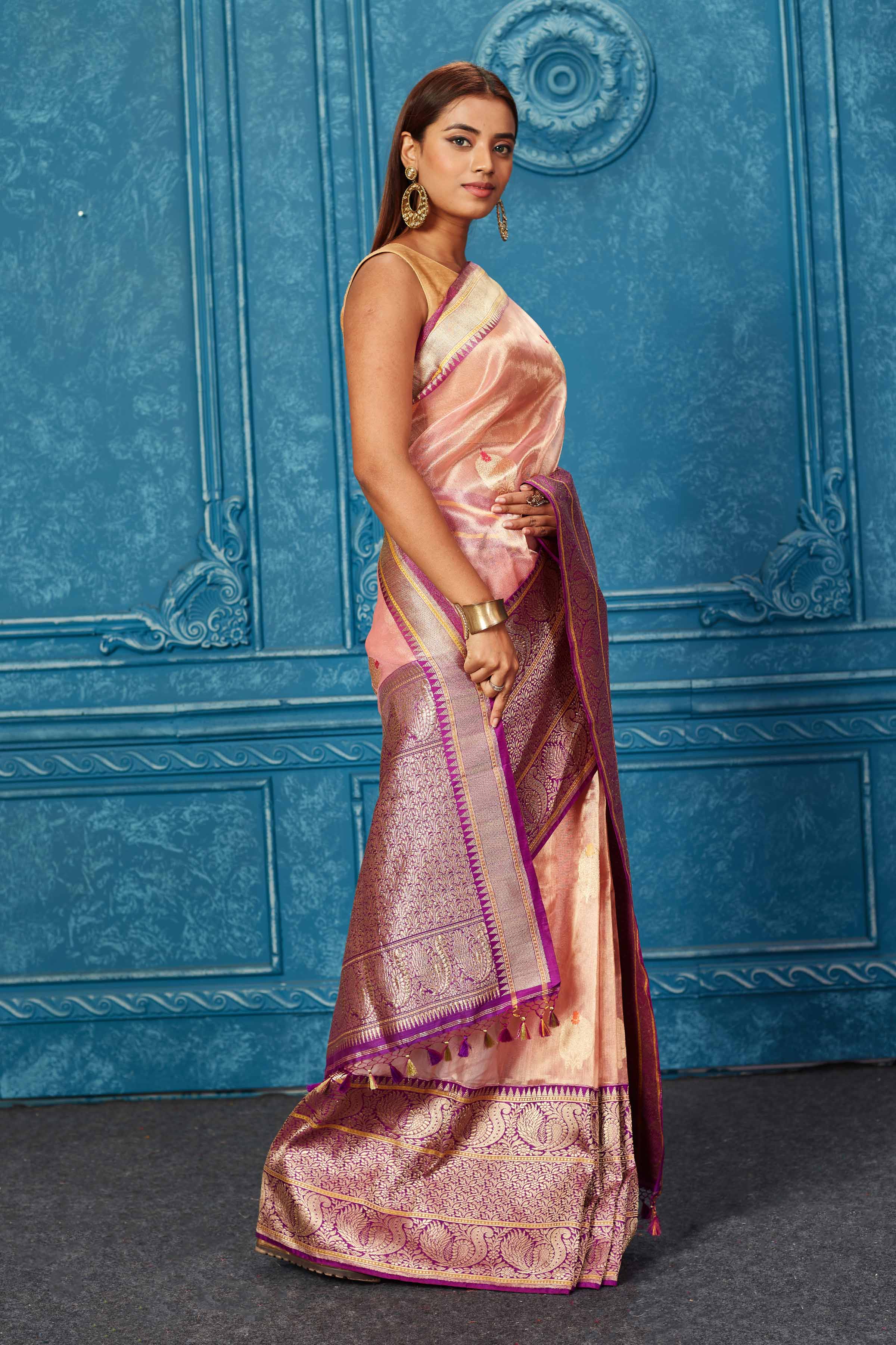 Buy golden pink Banarasi saree online in USA with purple zari border. Look your best on festive occasions in latest designer sarees, pure silk saris, Kanchipuram silk sarees, handwoven sarees, tussar silk sarees, embroidered sarees from Pure Elegance Indian saree store in USA.-side