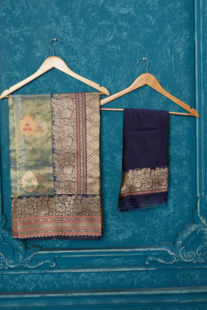 Shop greenish golden Banarasi saree online in USA with blue zari border. Look your best on festive occasions in latest designer sarees, pure silk saris, Kanchipuram silk sarees, handwoven sarees, tussar silk sarees, embroidered sarees from Pure Elegance Indian saree store in USA.-blouse