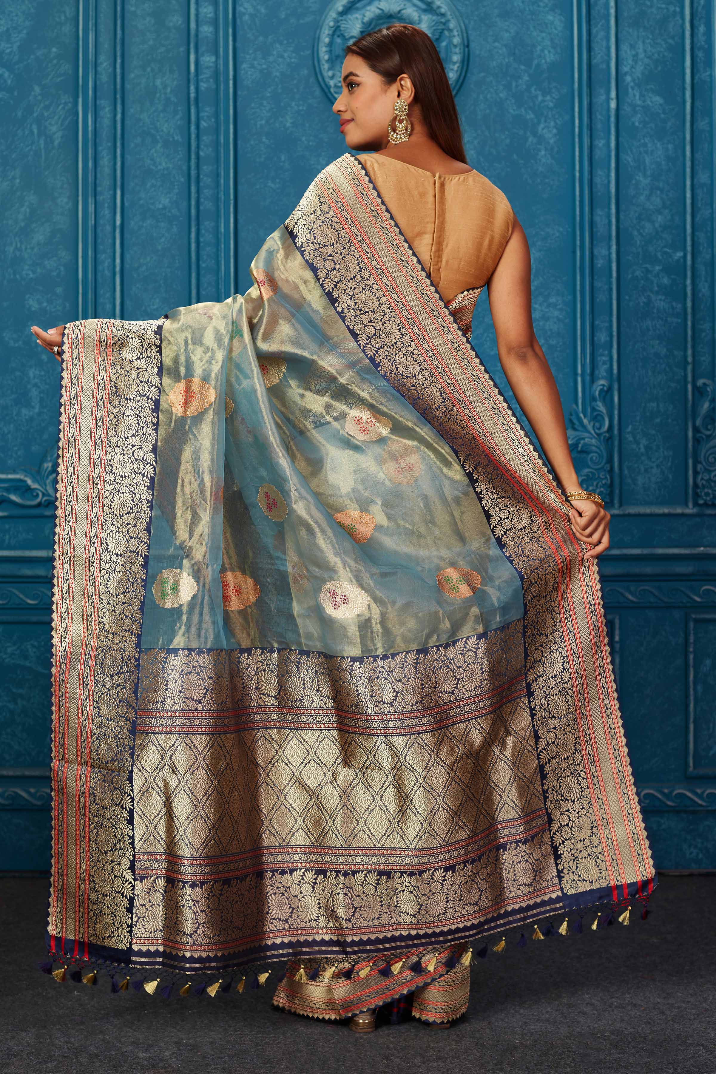 Shop greenish golden Banarasi saree online in USA with blue zari border. Look your best on festive occasions in latest designer sarees, pure silk saris, Kanchipuram silk sarees, handwoven sarees, tussar silk sarees, embroidered sarees from Pure Elegance Indian saree store in USA.-back