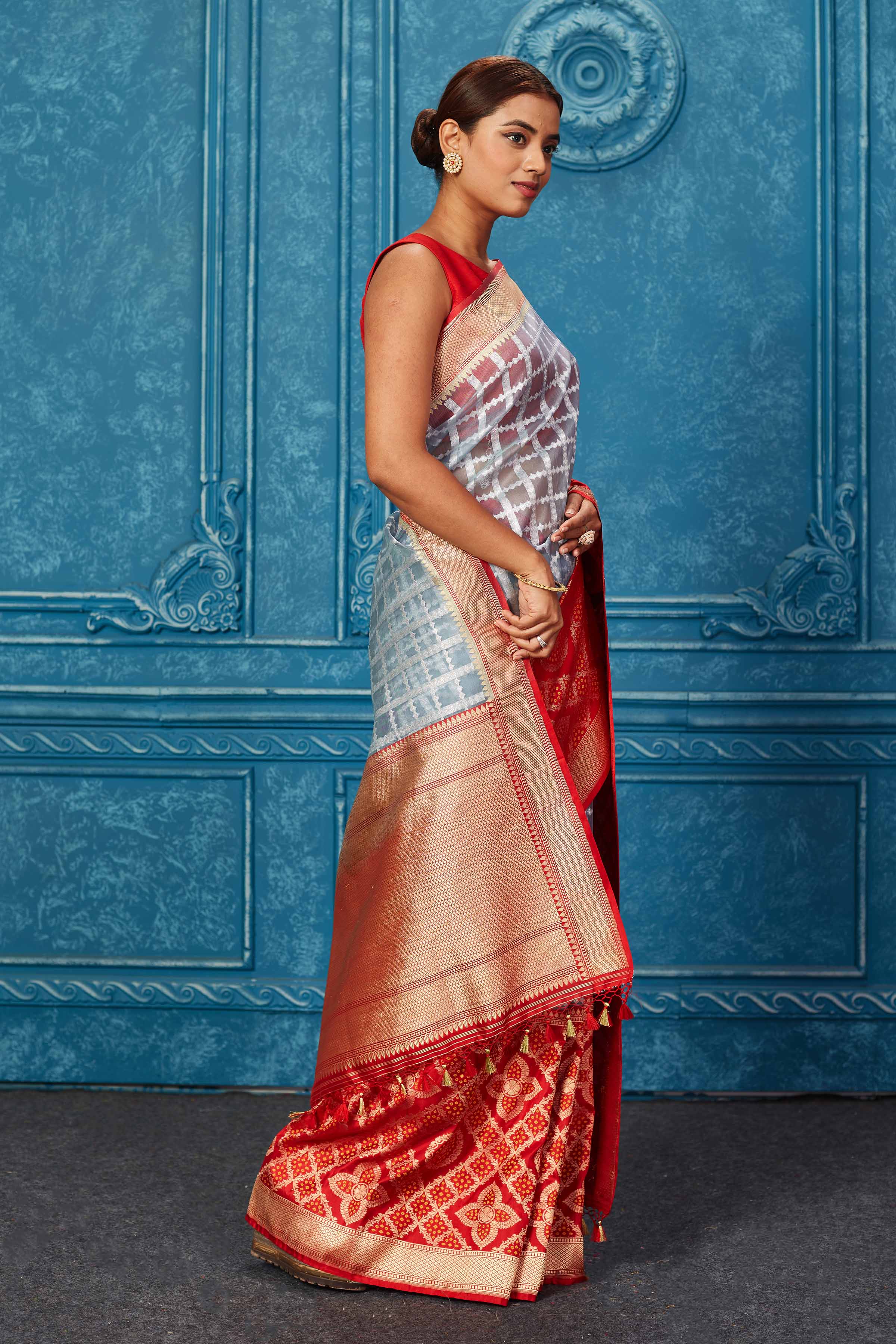 Buy powder blue check Banarasi saree online in USA with red zari border. Look your best on festive occasions in latest designer sarees, pure silk saris, Kanchipuram silk sarees, handwoven sarees, tussar silk sarees, embroidered sarees from Pure Elegance Indian saree store in USA.-side