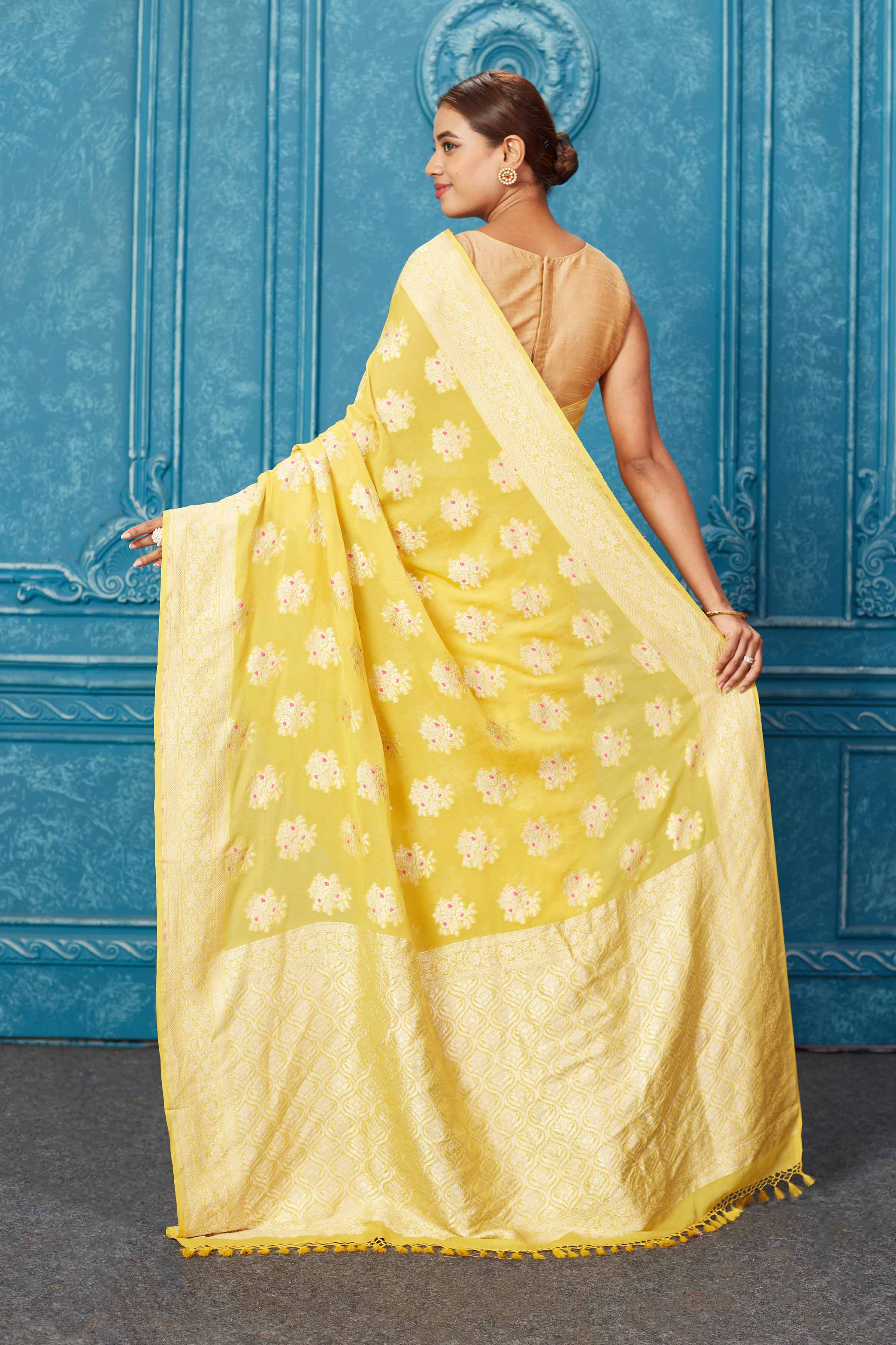 Shop beautiful yellow georgette Banarasi sari online in USA with zari minakari buta. Keep your ethnic wardrobe up to date with latest designer sarees, pure silk sarees, Kanchipuram silk sarees, handwoven sarees, tussar silk sarees, embroidered sarees from Pure Elegance Indian saree store in USA.-back