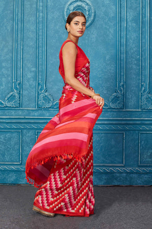 Shop stunning red and pink printed silk saree online in USA . Keep your ethnic wardrobe up to date with latest designer sarees, pure silk sarees, Kanchipuram silk saris, handwoven sarees, tussar silk sarees, embroidered sarees from Pure Elegance Indian saree store in USA.-side