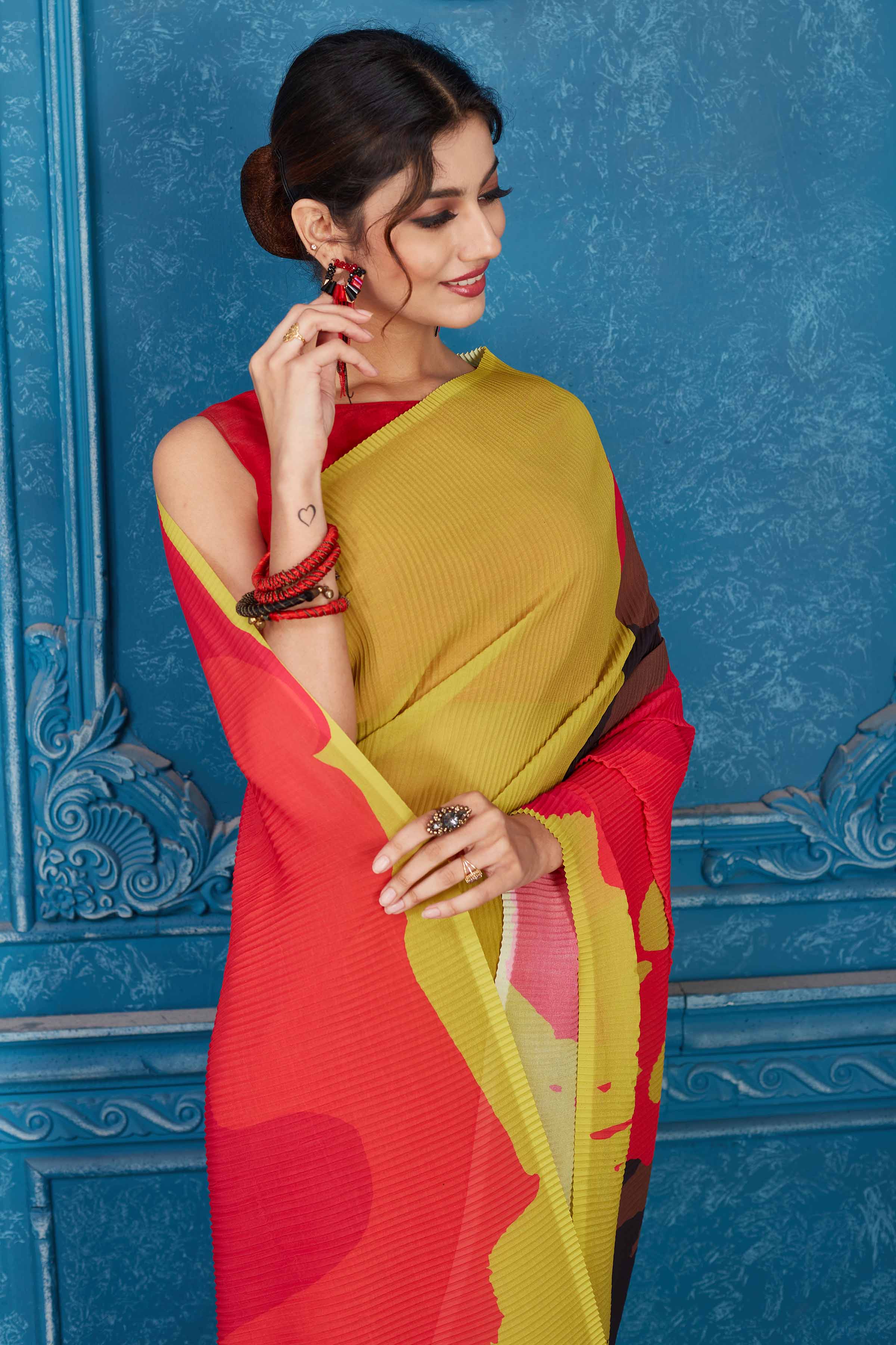 Shop beautiful olive green and red abstract print crushed georgette saree online in USA. Look your best on festive occasions in latest designer sarees, pure silk saris, Kanchipuram silk sarees, handwoven sarees, tussar silk sarees, embroidered saris from Pure Elegance Indian clothing store in USA.-closeup