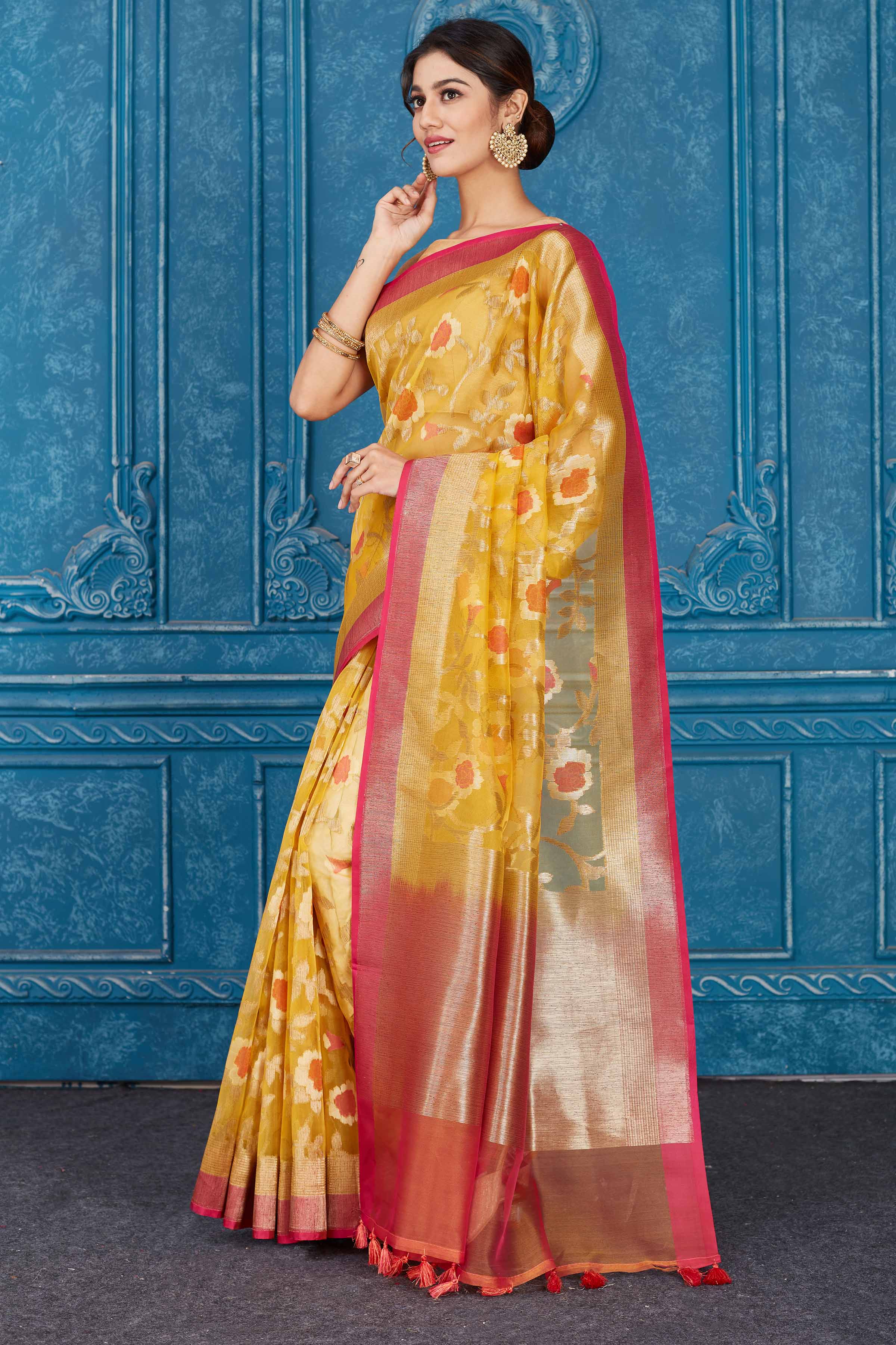 Shop yellow Kora Banarasi sari online in USA with pink border. Look your best on festive occasions in latest designer sarees, pure silk saris, Kanchipuram silk sarees, handwoven sarees, tussar silk sarees, embroidered saris from Pure Elegance Indian clothing store in USA.-pallu