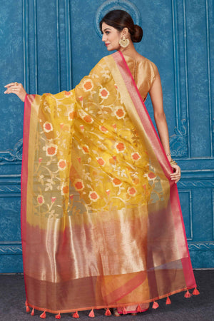 Shop yellow Kora Banarasi sari online in USA with pink border. Look your best on festive occasions in latest designer sarees, pure silk saris, Kanchipuram silk sarees, handwoven sarees, tussar silk sarees, embroidered saris from Pure Elegance Indian clothing store in USA.-back