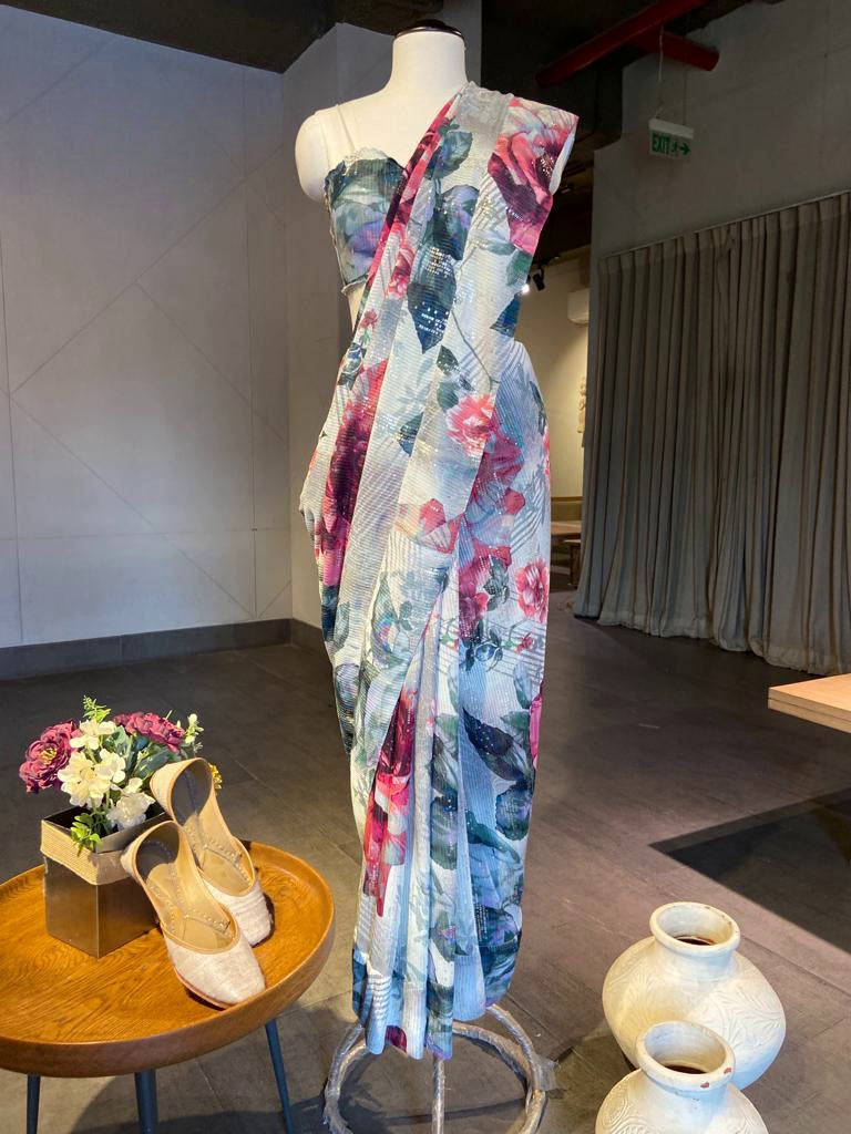 Shop beautiful grey and white printed floral sequin georgette saree online in USA. Look your best on festive occasions in latest designer saris, pure silk saris, Kanchipuram silk sarees, handwoven saris, tussar silk sarees, embroidered saris from Pure Elegance Indian clothing store in USA.-full view