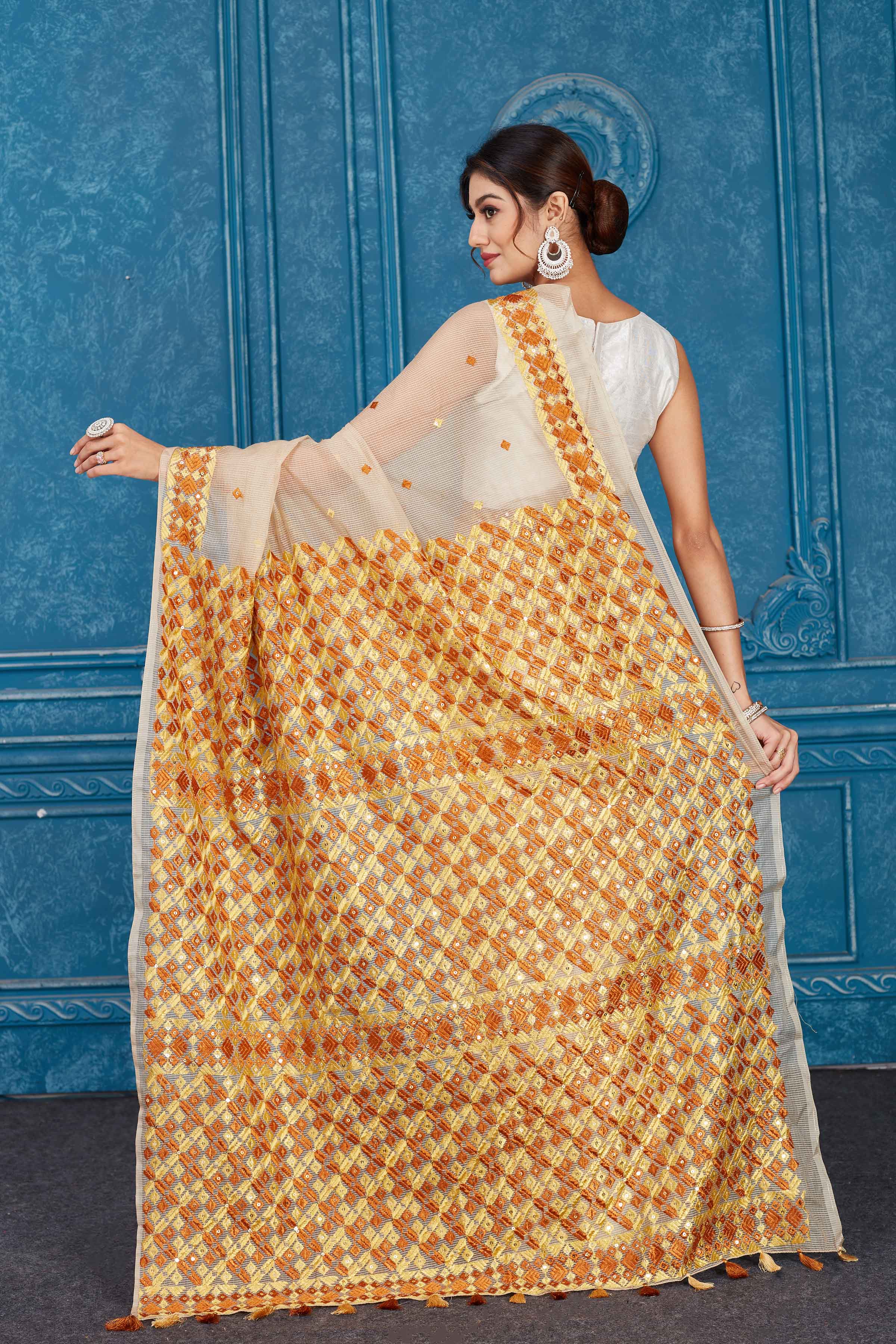 Shop cream Kota saree online in USA with Phulkari embroidery. Look your best on festive occasions in latest designer sarees, pure silk saris, Kanchipuram silk sarees, handwoven sarees, tussar silk sarees, embroidered saris from Pure Elegance Indian clothing store in USA.-back