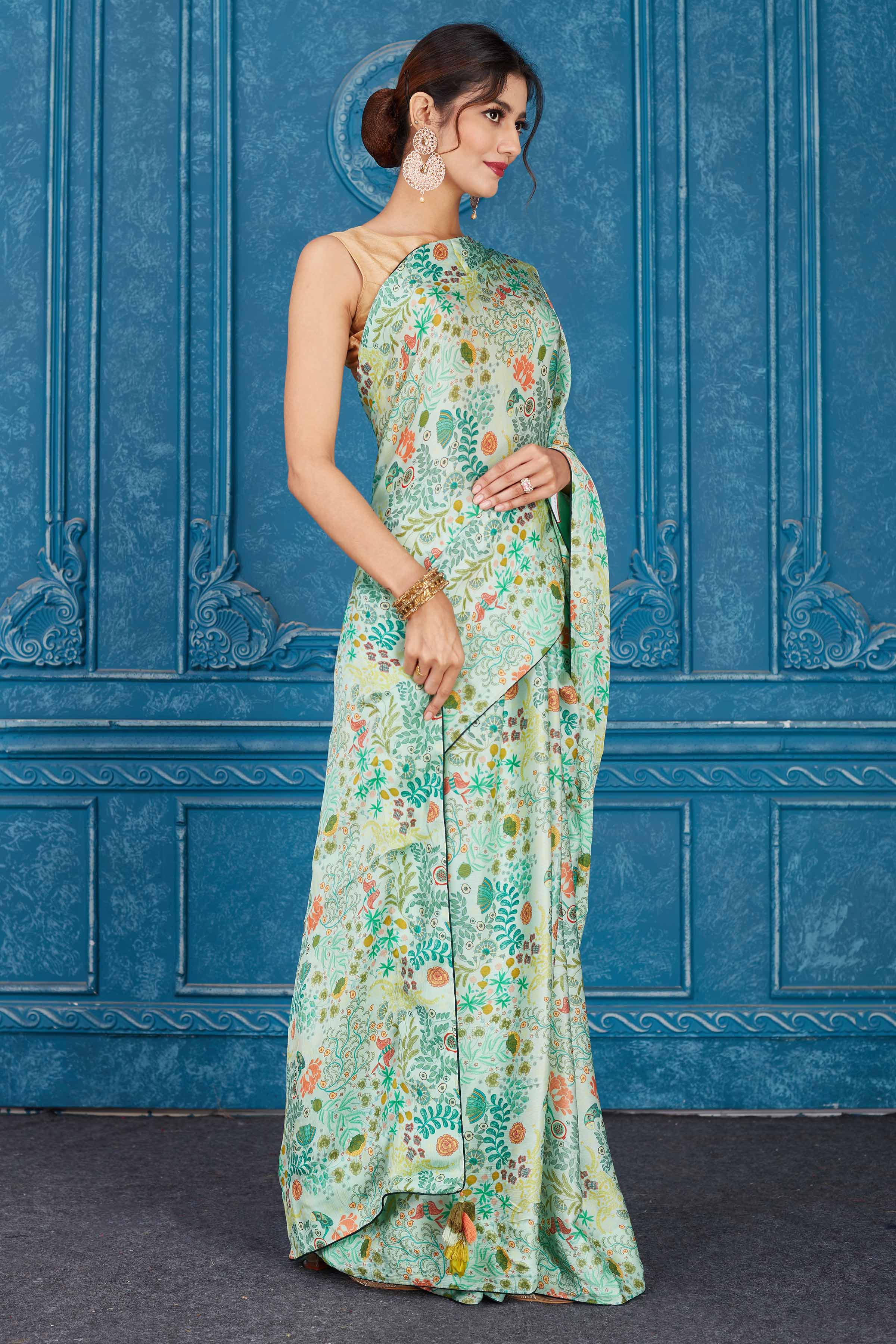 Shop mint green printed crepe chiffon sari online in USA. Look your best on festive occasions in latest designer sarees, pure silk saris, Kanchipuram silk sarees, handwoven sarees, tussar silk sarees, embroidered sarees from Pure Elegance Indian clothing store in USA.-side