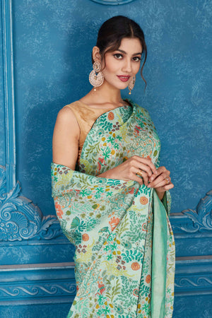 Shop mint green printed crepe chiffon sari online in USA. Look your best on festive occasions in latest designer sarees, pure silk saris, Kanchipuram silk sarees, handwoven sarees, tussar silk sarees, embroidered sarees from Pure Elegance Indian clothing store in USA.-closeup