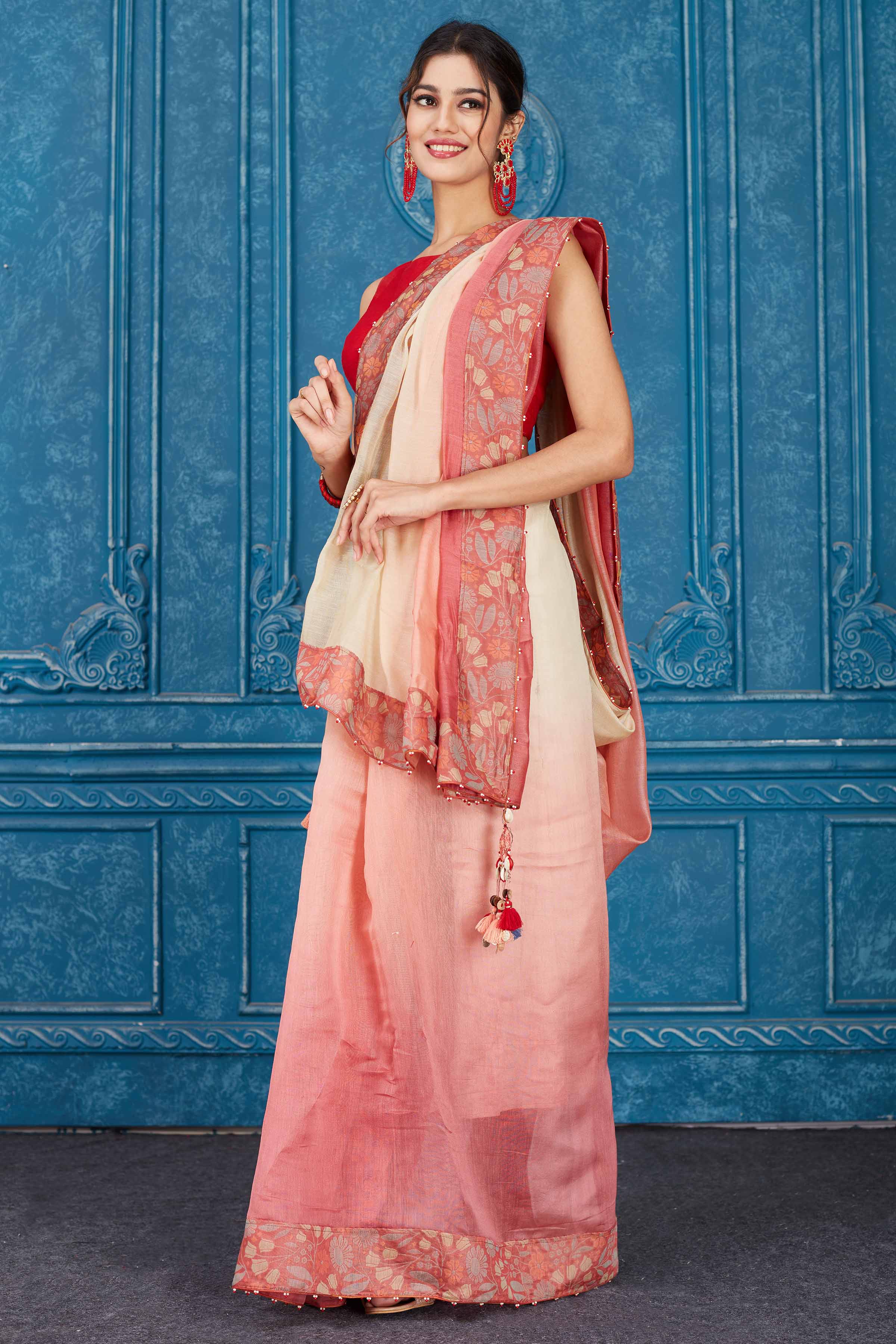 Shop ombre pink linen sari online in USA with floral border. Look your best on festive occasions in latest designer sarees, pure silk saris, Kanchipuram silk sarees, handwoven sarees, tussar silk sarees, embroidered saris from Pure Elegance Indian clothing store in USA.-side