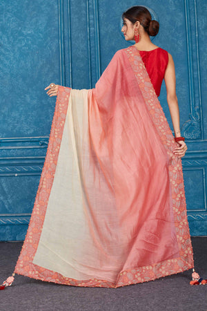 Shop ombre pink linen sari online in USA with floral border. Look your best on festive occasions in latest designer sarees, pure silk saris, Kanchipuram silk sarees, handwoven sarees, tussar silk sarees, embroidered saris from Pure Elegance Indian clothing store in USA.-back