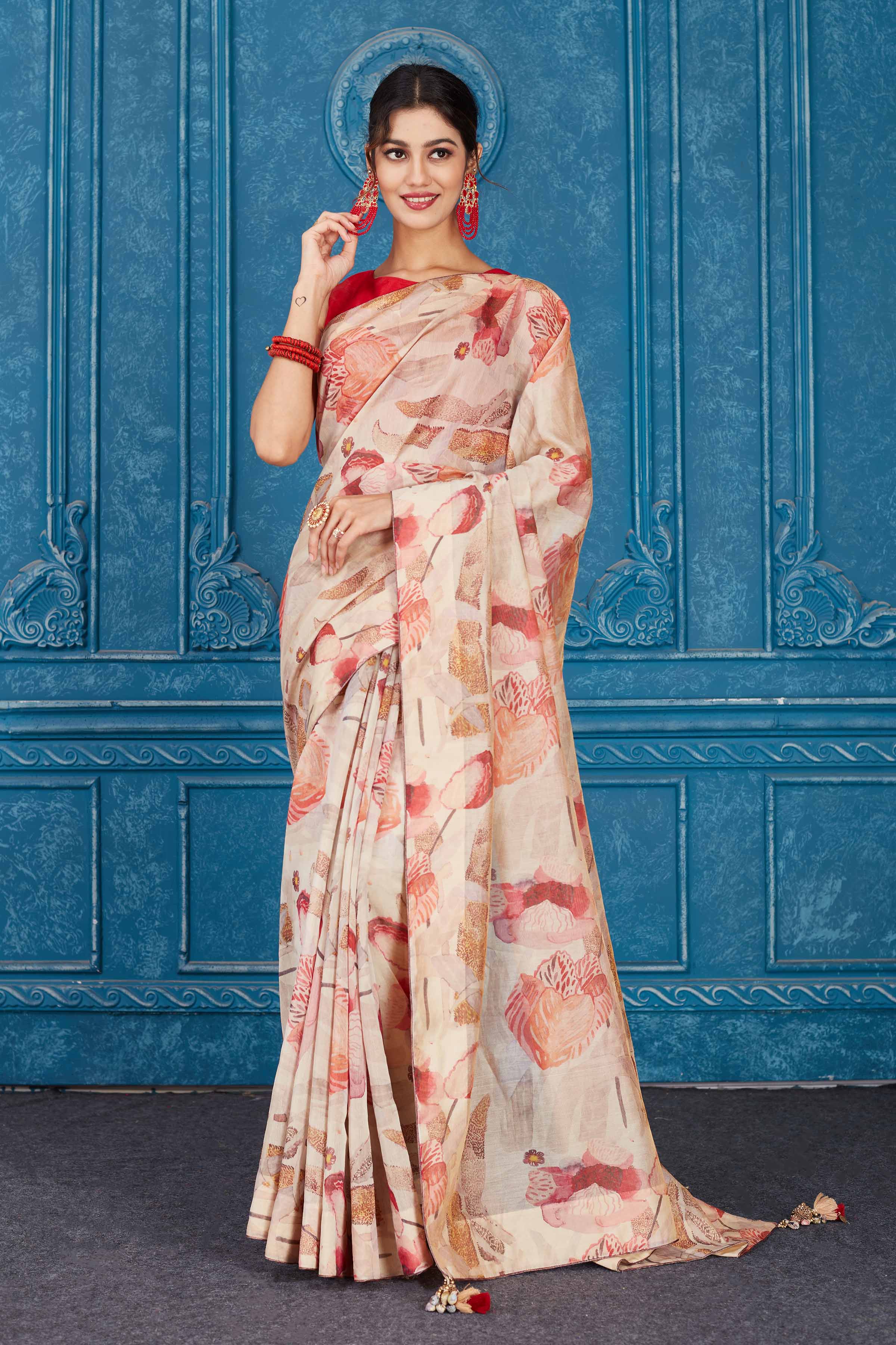 Shop stunning cream and red floral print linen sari online in USA. Look your best on festive occasions in latest designer sarees, pure silk saris, Kanchipuram silk sarees, handwoven sarees, tussar silk sarees, embroidered saris from Pure Elegance Indian clothing store in USA.-full view