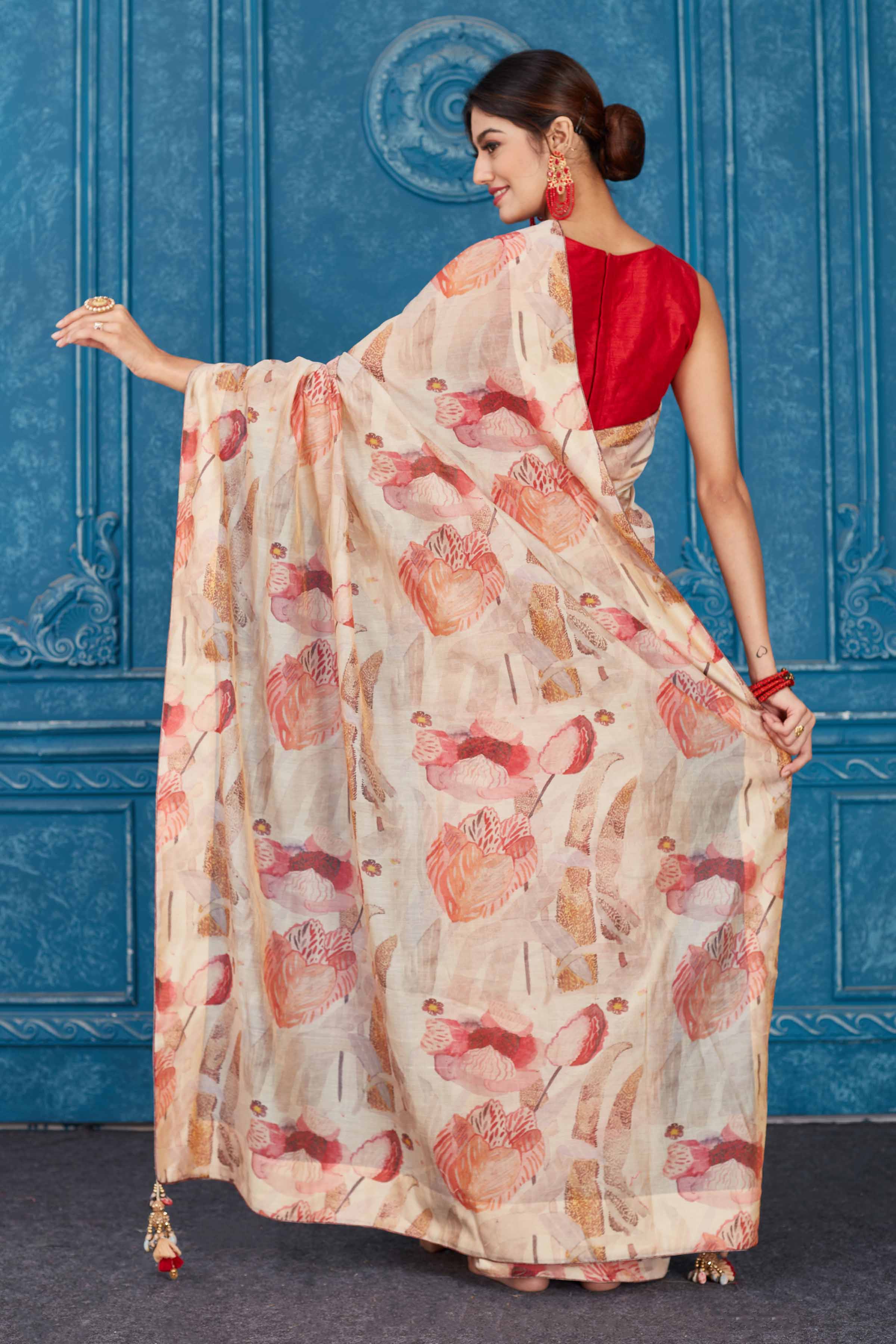 Shop stunning cream and red floral print linen sari online in USA. Look your best on festive occasions in latest designer sarees, pure silk saris, Kanchipuram silk sarees, handwoven sarees, tussar silk sarees, embroidered saris from Pure Elegance Indian clothing store in USA.-back