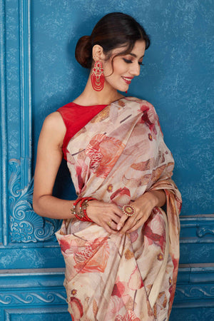 Shop stunning cream and red floral print linen sari online in USA. Look your best on festive occasions in latest designer sarees, pure silk saris, Kanchipuram silk sarees, handwoven sarees, tussar silk sarees, embroidered saris from Pure Elegance Indian clothing store in USA.-closeup