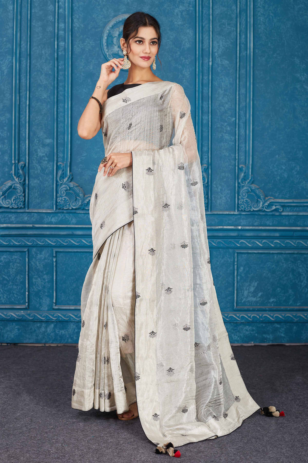 Shop silver tissue silk sari online in USA with black floral buta. Look your best on festive occasions in latest designer sarees, pure silk saris, Kanchipuram silk sarees, handwoven sarees, tussar silk sarees, embroidered saris from Pure Elegance Indian clothing store in USA.-full view