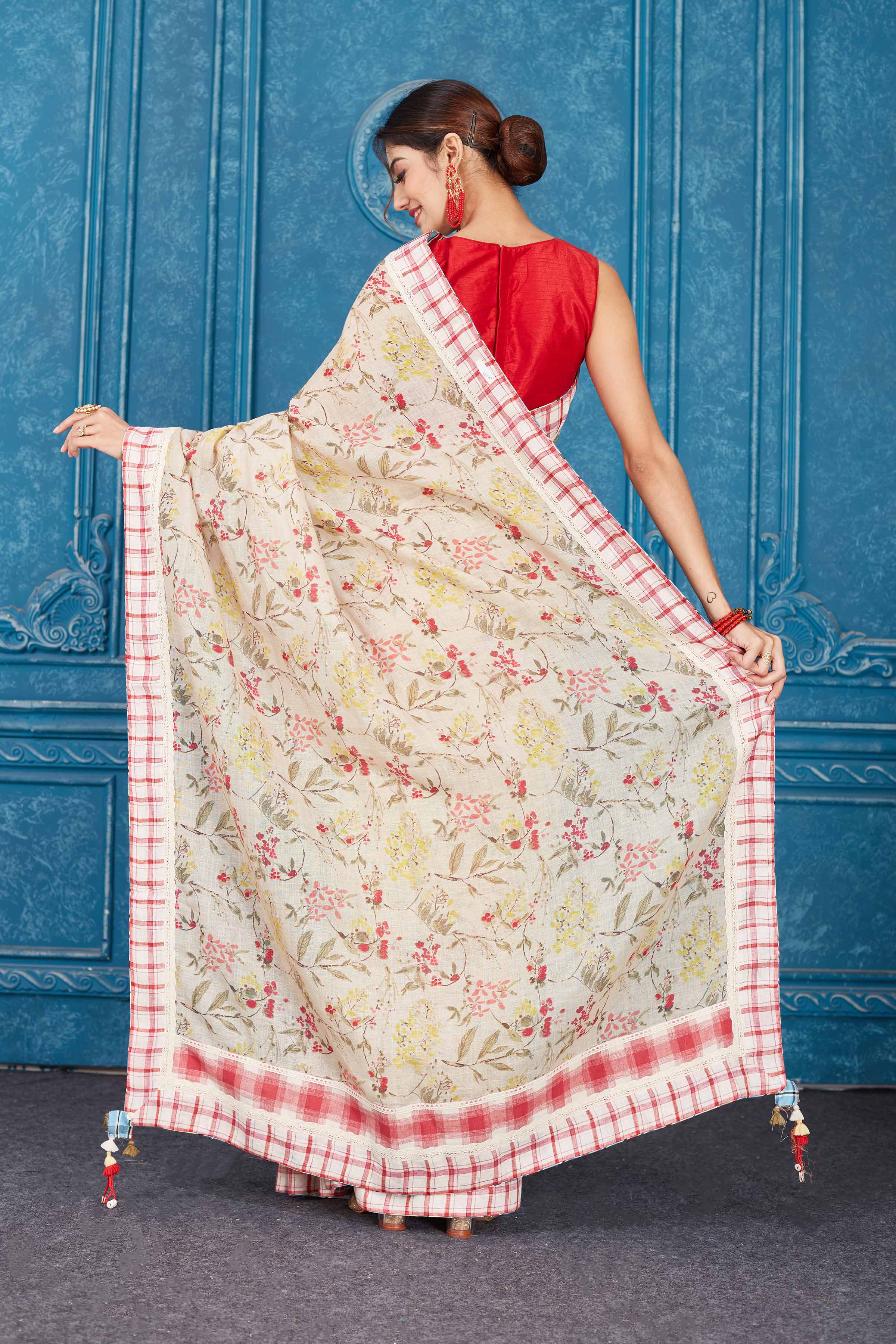 Shop cream printed linen saree online in USA with check border Look your best on festive occasions in latest designer sarees, pure silk saris, Kanchipuram silk sarees, handwoven sarees, tussar silk sarees, embroidered saris from Pure Elegance Indian clothing store in USA.-back