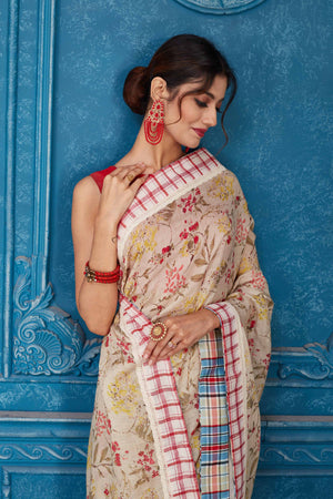 Shop cream printed linen saree online in USA with check border Look your best on festive occasions in latest designer sarees, pure silk saris, Kanchipuram silk sarees, handwoven sarees, tussar silk sarees, embroidered saris from Pure Elegance Indian clothing store in USA.-closeup