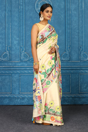 Shop cream tussar silk sari online in USA with floral Kantha embroidery. Look your best on festive occasions in latest designer sarees, pure silk sarees, Kanchipuram sarees, handwoven sarees, tussar silk sarees, embroidered sarees from Pure Elegance Indian clothing store in USA.-side