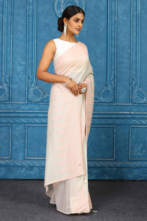 Buy beautiful baby pink georgette sequin saree online in USA with temple border. Look your best on festive occasions in latest designer sarees, pure silk sarees, Kanchipuram sarees, handwoven sarees, tussar silk sarees, embroidered sarees from Pure Elegance Indian clothing store in USA.-side