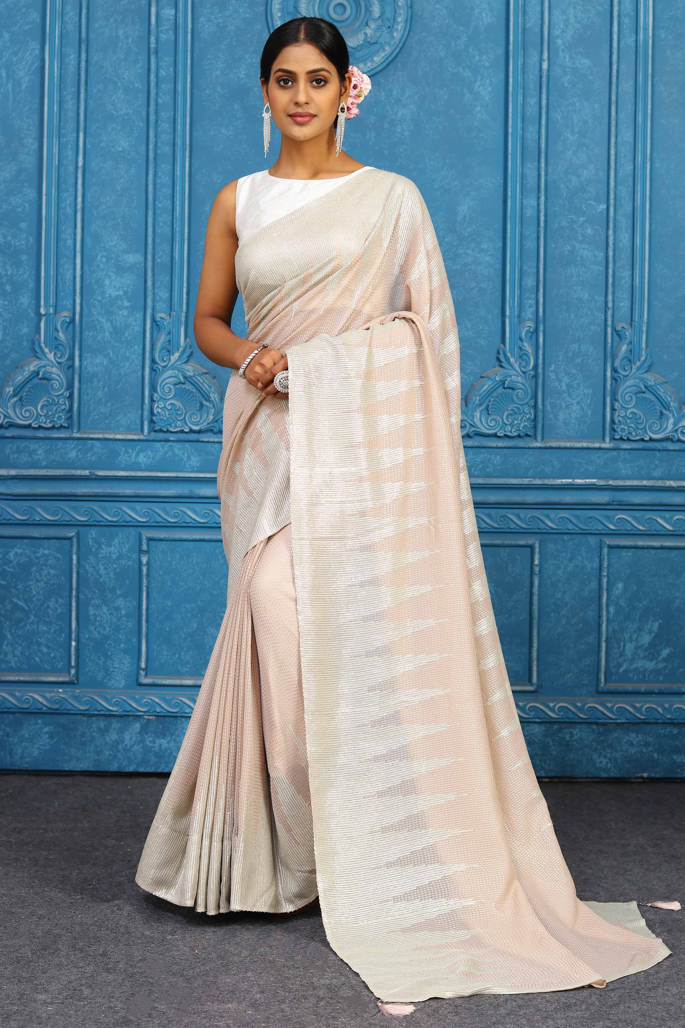 Shop beautiful pink georgette sequin sari online in USA with temple border. Look your best on festive occasions in latest designer sarees, pure silk sarees, Kanchipuram sarees, handwoven sarees, tussar silk sarees, embroidered sarees from Pure Elegance Indian clothing store in USA.-full view