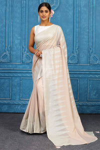 Shop beautiful pink georgette sequin sari online in USA with temple border. Look your best on festive occasions in latest designer sarees, pure silk sarees, Kanchipuram sarees, handwoven sarees, tussar silk sarees, embroidered sarees from Pure Elegance Indian clothing store in USA.-full view