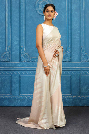 Shop beautiful pink georgette sequin sari online in USA with temple border. Look your best on festive occasions in latest designer sarees, pure silk sarees, Kanchipuram sarees, handwoven sarees, tussar silk sarees, embroidered sarees from Pure Elegance Indian clothing store in USA.-side