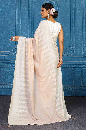 Shop beautiful pink georgette sequin sari online in USA with temple border. Look your best on festive occasions in latest designer sarees, pure silk sarees, Kanchipuram sarees, handwoven sarees, tussar silk sarees, embroidered sarees from Pure Elegance Indian clothing store in USA.-back