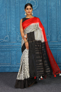 Buy beautiful off-white and grey pochampally ikkat sari online in USA with red black border. Look your best on festive occasions in latest designer sarees, pure silk sarees, Kanchipuram sarees, handwoven sarees, tussar silk sarees, embroidered sarees from Pure Elegance Indian clothing store in USA.-full view