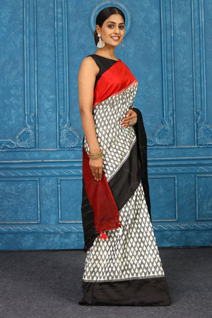 Buy beautiful off-white and grey pochampally ikkat sari online in USA with red black border. Look your best on festive occasions in latest designer sarees, pure silk sarees, Kanchipuram sarees, handwoven sarees, tussar silk sarees, embroidered sarees from Pure Elegance Indian clothing store in USA.-side